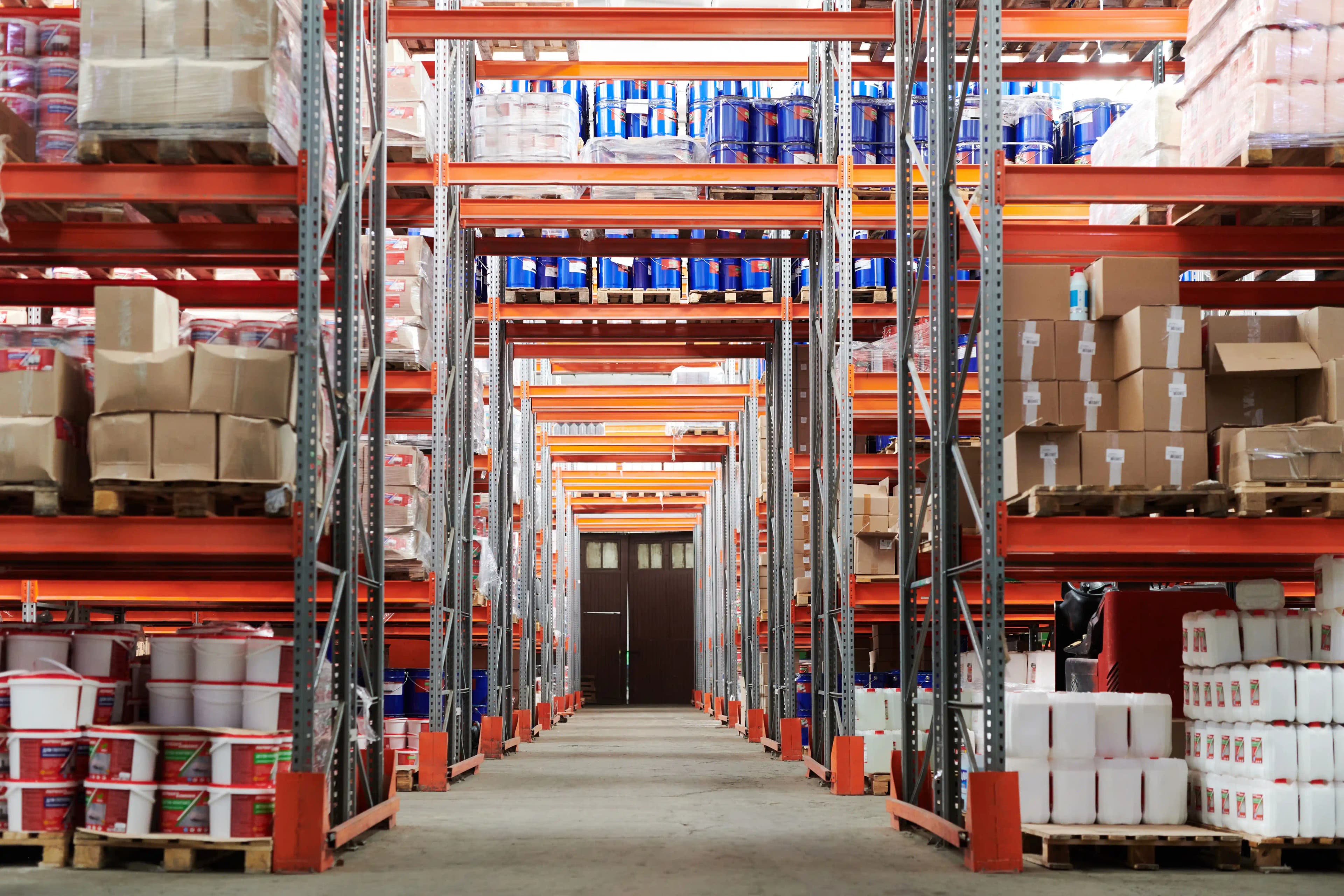 Loaded pallet racking in a distribution warehouse Loaded pallet racking in a distribution warehouse